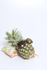 Pineapple wearing sunglasses isolated with white background - 78382113