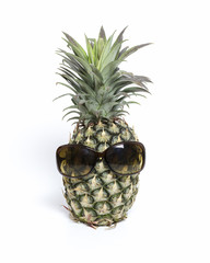 Pineapple wearing sunglasses isolated with white background