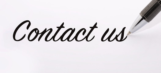Obraz premium Pen write contact us on paper