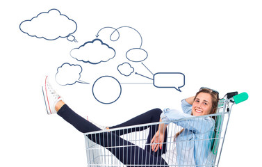 Blonde pretty girl inside supermarket cart