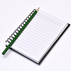 Pencil on blank notepad.