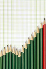 Pencils arrangement in pattern of graph on graph sheet.