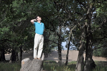 Happy man in the oak forest