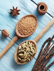 Different spices on old wooden table.