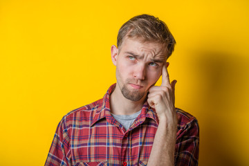 fingers to his temple