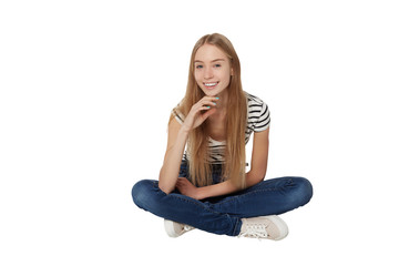 Front view of smiling beautiful woman sitting on the floor