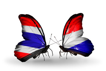 Two butterflies with flags Thailand and Holland