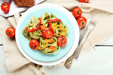 Tasty pasta with pepper, carrot and tomatoes