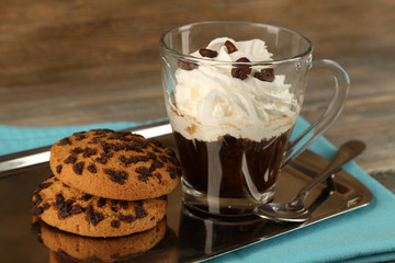 Cup of coffee with cream and cookies