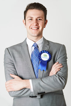 Portrait Of Conservative Politician Wearing Blue Rosette