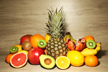 Naklejka na ściany i meble Assortment of exotic fruits on wooden background