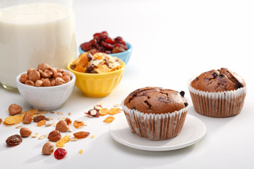 Delicious chocolate muffins on wooden board 