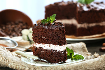 Delicious chocolate cake on table close-up