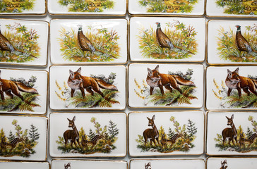 Wild animal motives on handmade porcelain fridge magnets.