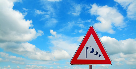 wind sock sign under a blue sky
