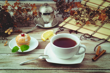 Cup of tea with muffin