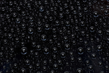 Water drops on black surface