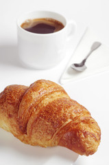 Breakfast with croissant and coffee