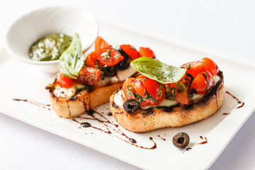 Bruschetta with tomato, mozarella and basil