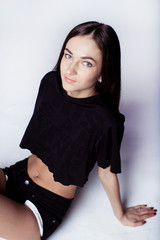 Beautiful young girl in black shorts and t-shirt 