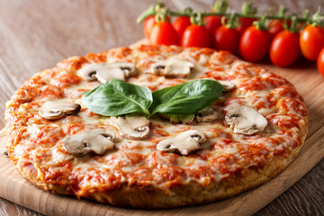 Pizza with mushrooms and basil