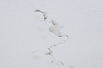 Cracked peeling layer on ceiling