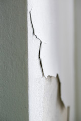 Cracking and peeling concrete wall