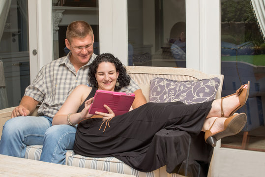 Couple on Patio - Powered by Adobe