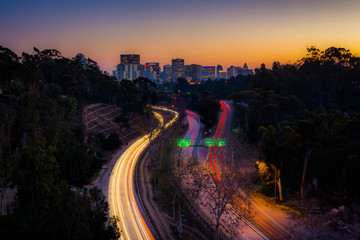 California Route 163 and the San Diego Skyline at night, seen fr