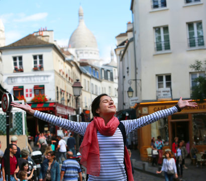 Happy beautiful girl on Montmartre in Paris