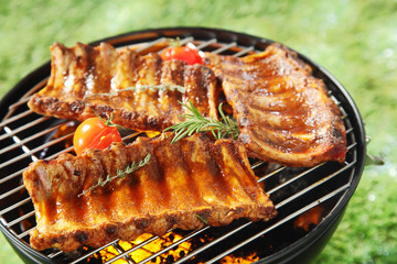 Succulent spicy spare ribs on a barbecue