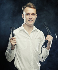 young t hairstylist looking at camera