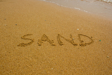 Sand handwritten on the beach