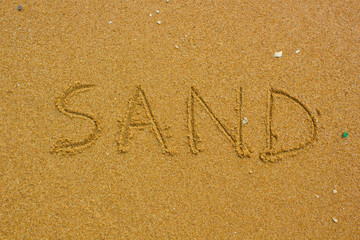 Sand handwritten on the beach