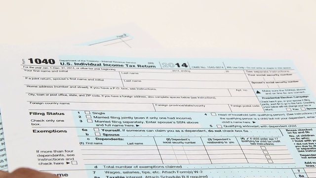 Income tax form and pen. Finance concept  1040 form