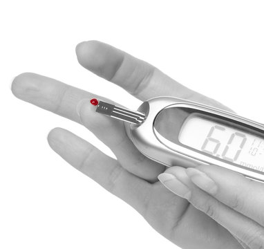 Diabetes patient hands measuring glucose level blood test
