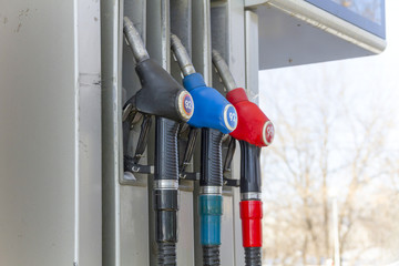 Fuel dispenser with pistols at the gas station