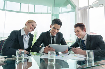 business partners discussing documents and ideas at meeting