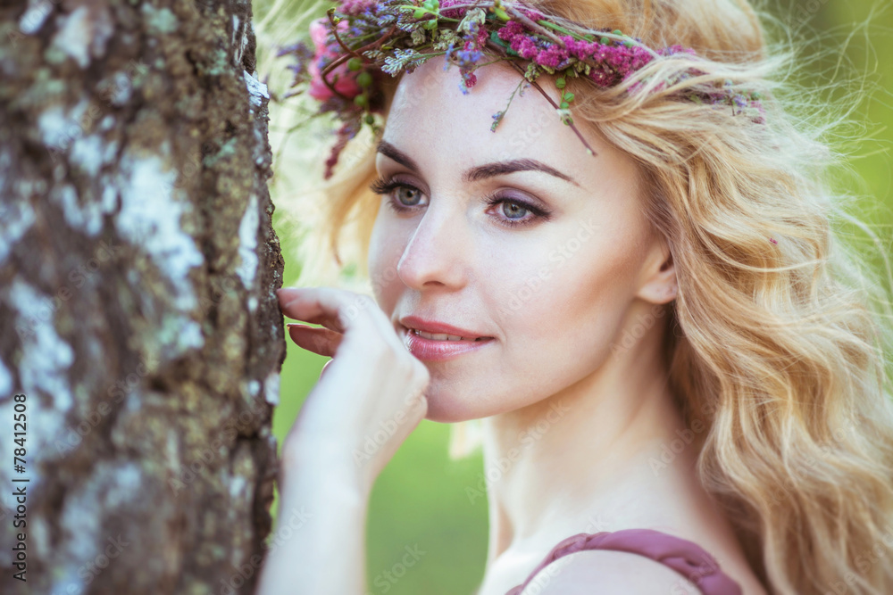 Wall mural portrait of charming girl with blond hair