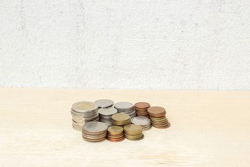 group thai baht coin money on plywood and concrete wall