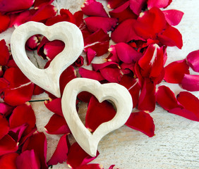 Love: white hearts and red rose petals :)