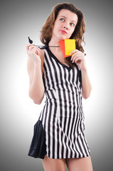Woman referee with card on white