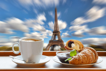 Coffee with croissants against Eiffel Tower in Paris, France