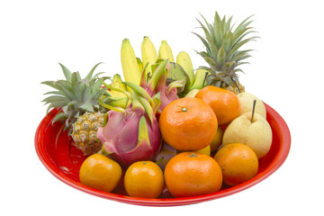 Naklejka na ściany i meble Fresh fruits on red tray isolated on a white.