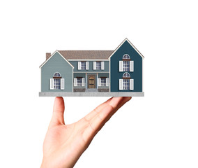 holding house representing home ownership