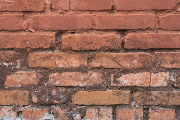 Fototapeta premium Old red painted brick wall