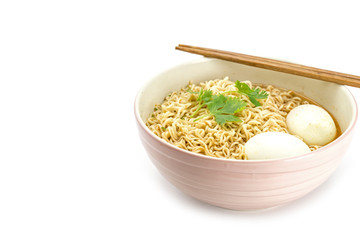 Noodles with boiled eggs in bowl and chopsticks