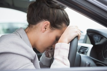 Woman sleeping on the wheel