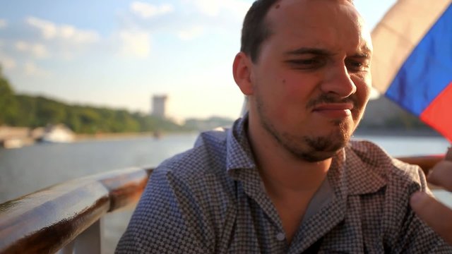 Handsome man eating food in outdoors restaurant on luxury yacht