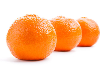 Three mandarin isolated on a white background
